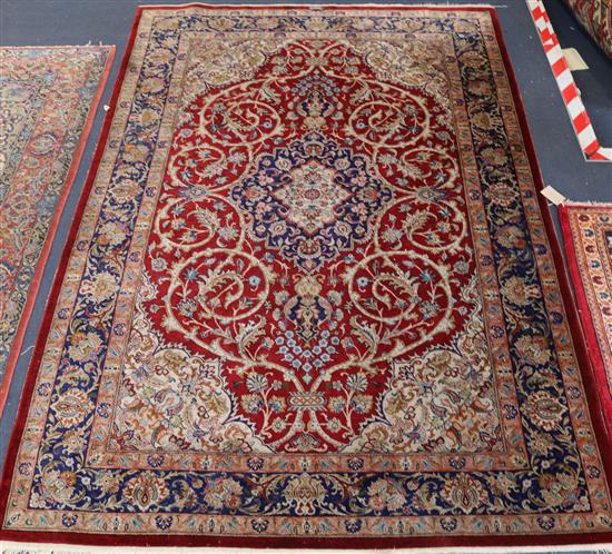 A Tabriz red ground silk rug 198 x 133cm.